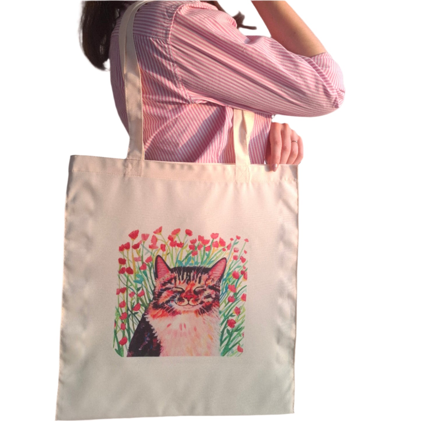 Tote bag with a cat sitting in a pink flower meadow – hand-painted floral cat art, printed by the artist.