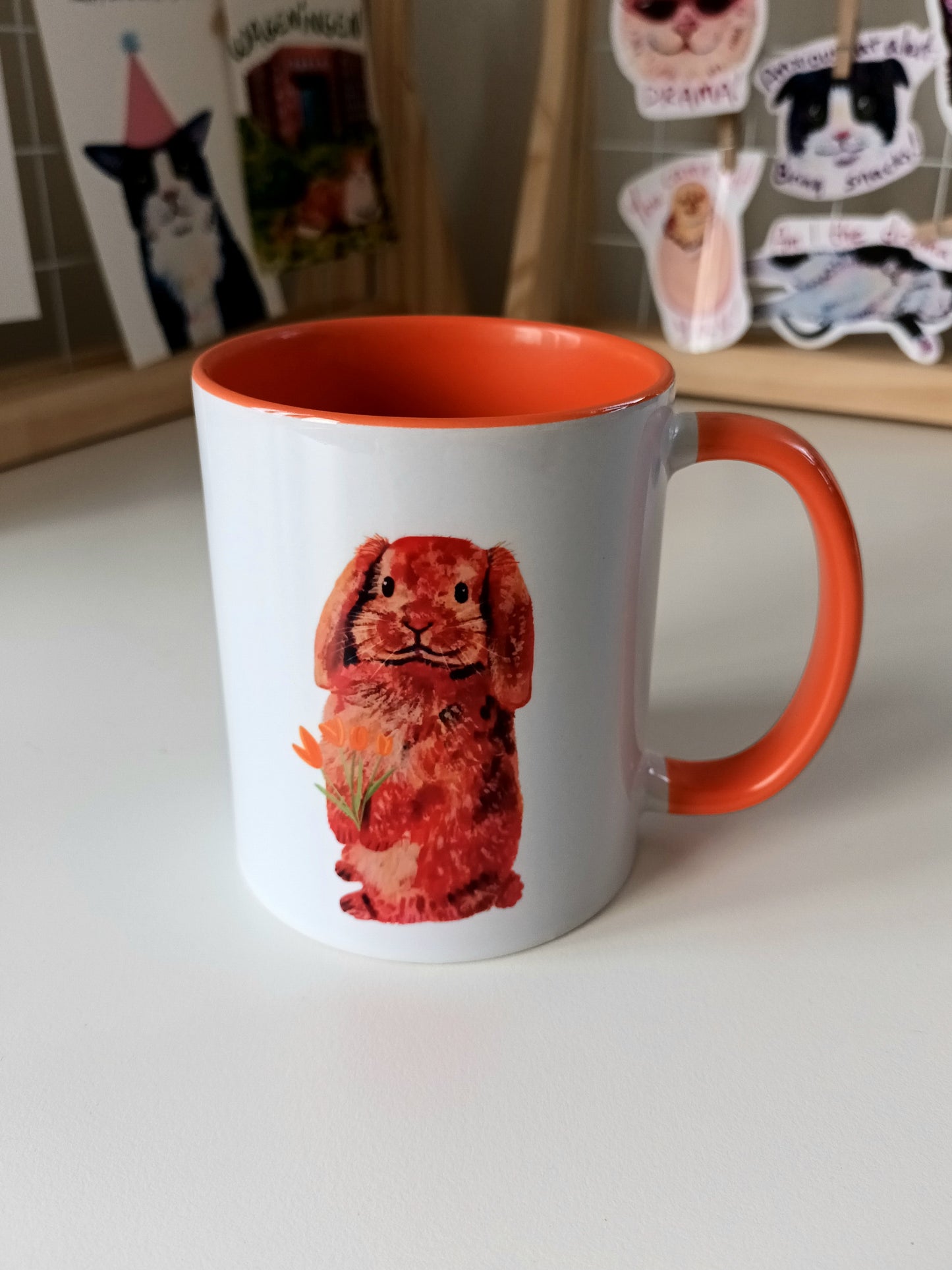 Handmade ceramic mug featuring a bunny holding flowers – perfect for spring lovers!