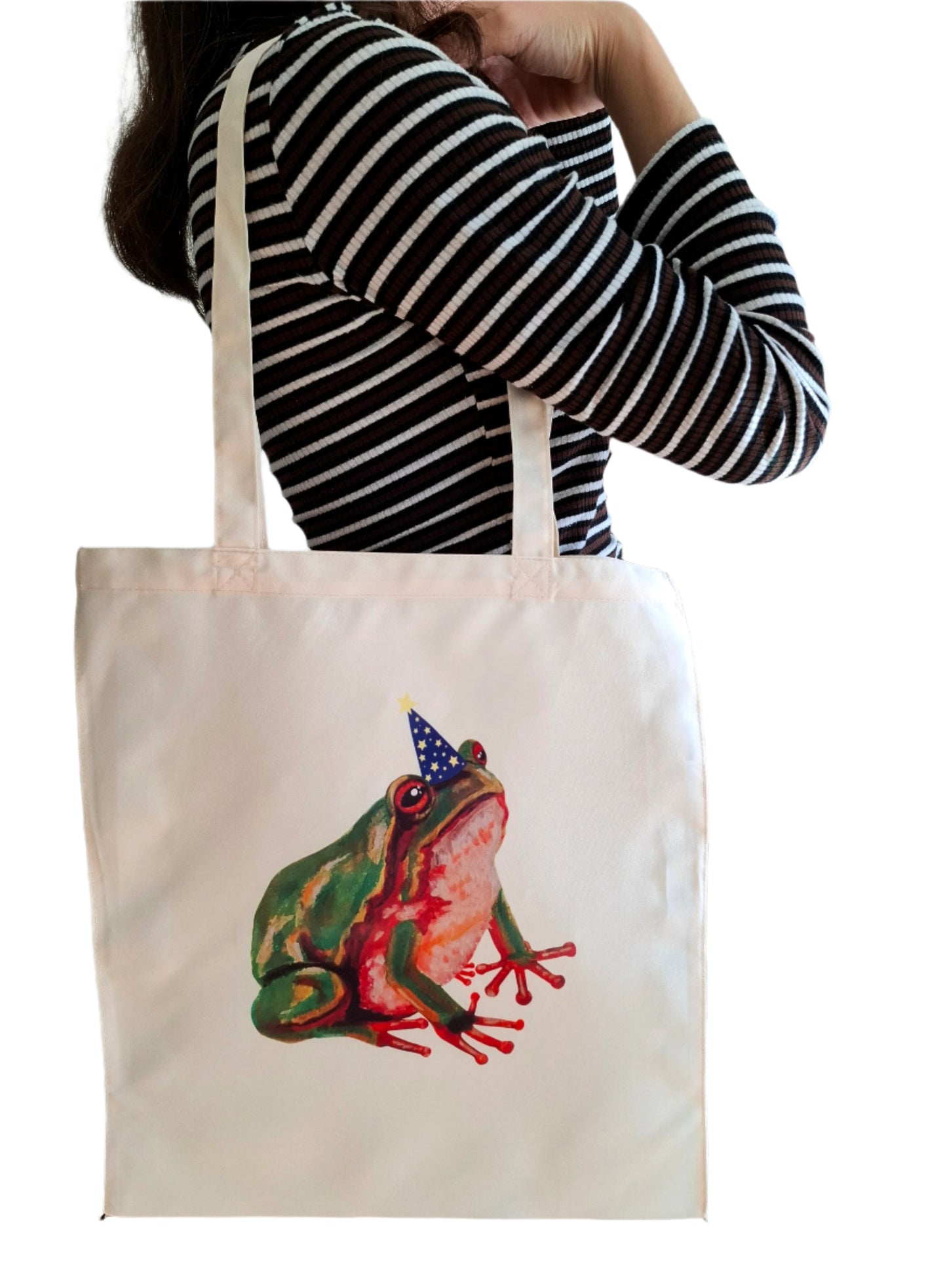 Handmade tote bag with a hand-painted design of a green frog wearing a magician hat