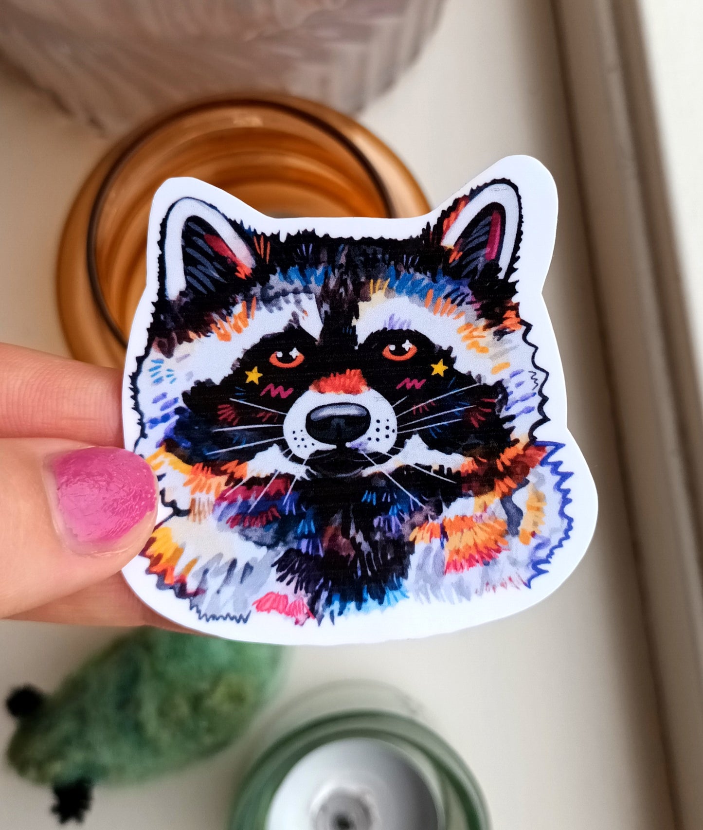 Cute vinyl sticker of a raccoon on waterproof vinyl, approximately 6 x 6 cm