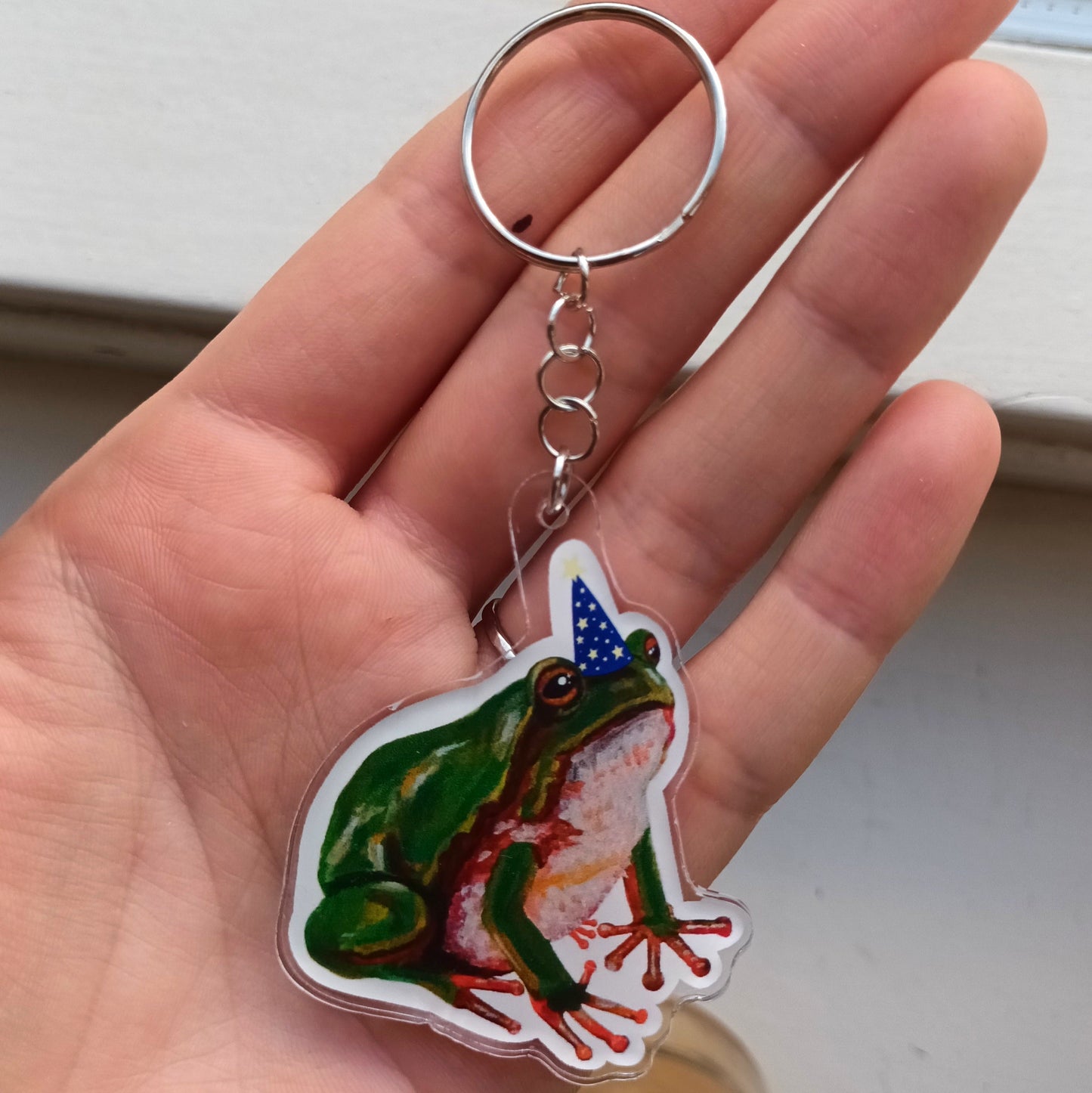 Acrylic keychain with cute frog wearing wizard's hat