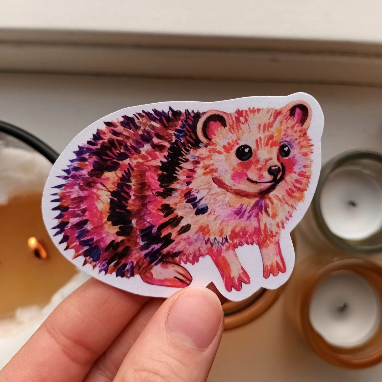 Cute handmade hedgehog sticker featuring a smiling hedgehog, printed on waterproof vinyl, nature-inspired animal art.
