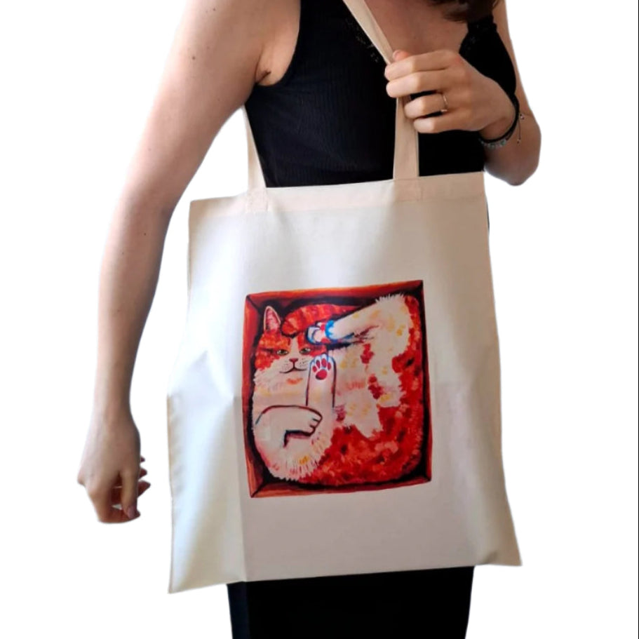 Tote bag featuring a cute orange cat in a box, hand-painted and printed by the artist, made of waterproof 100% polyester.