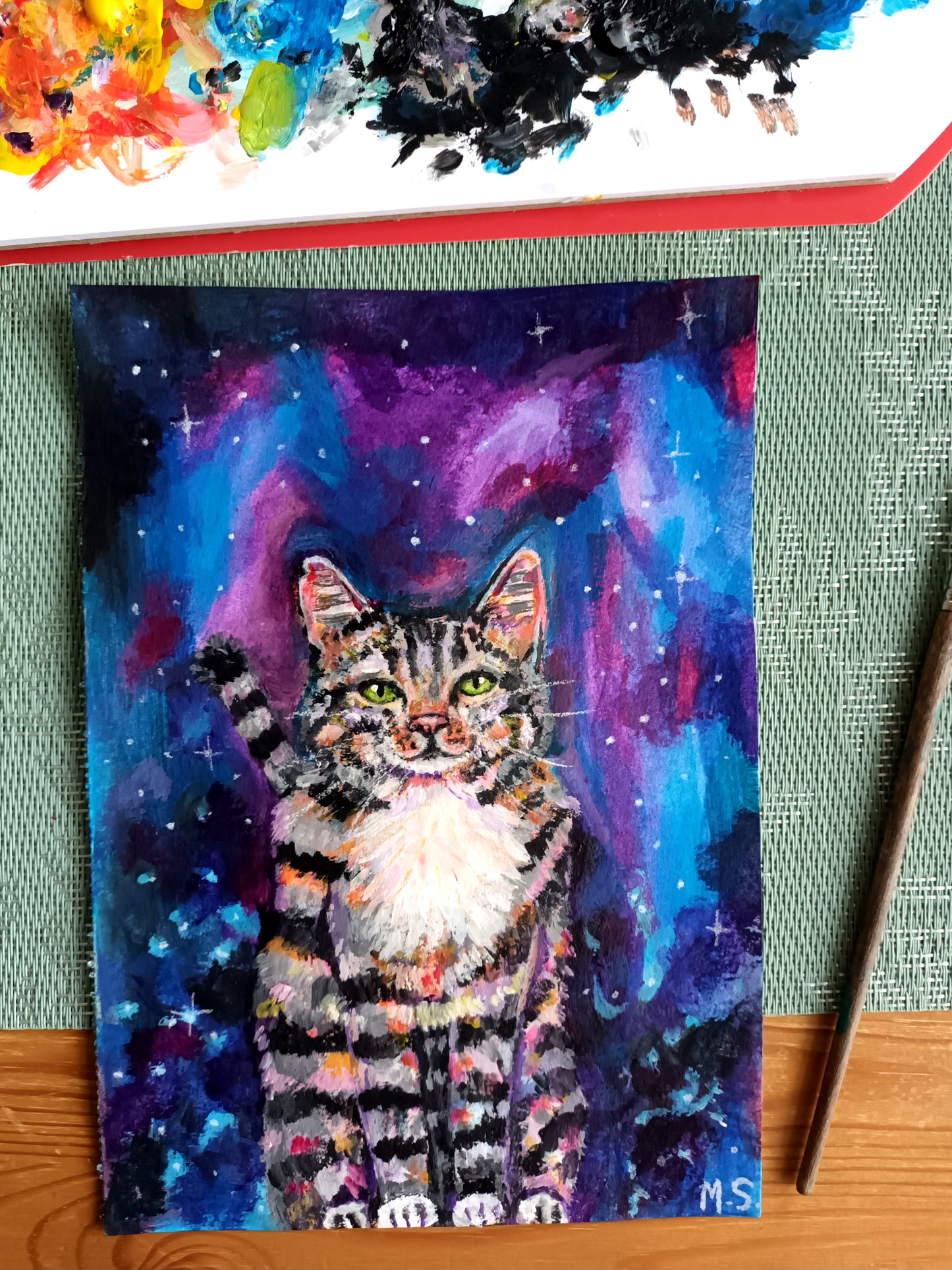 Custom hand-painted pet portrait on A5, A4, or A3 canvas, featuring detailed and vibrant artwork. Personalised pet painting, available for free local pickup or shipping, painting on a table.