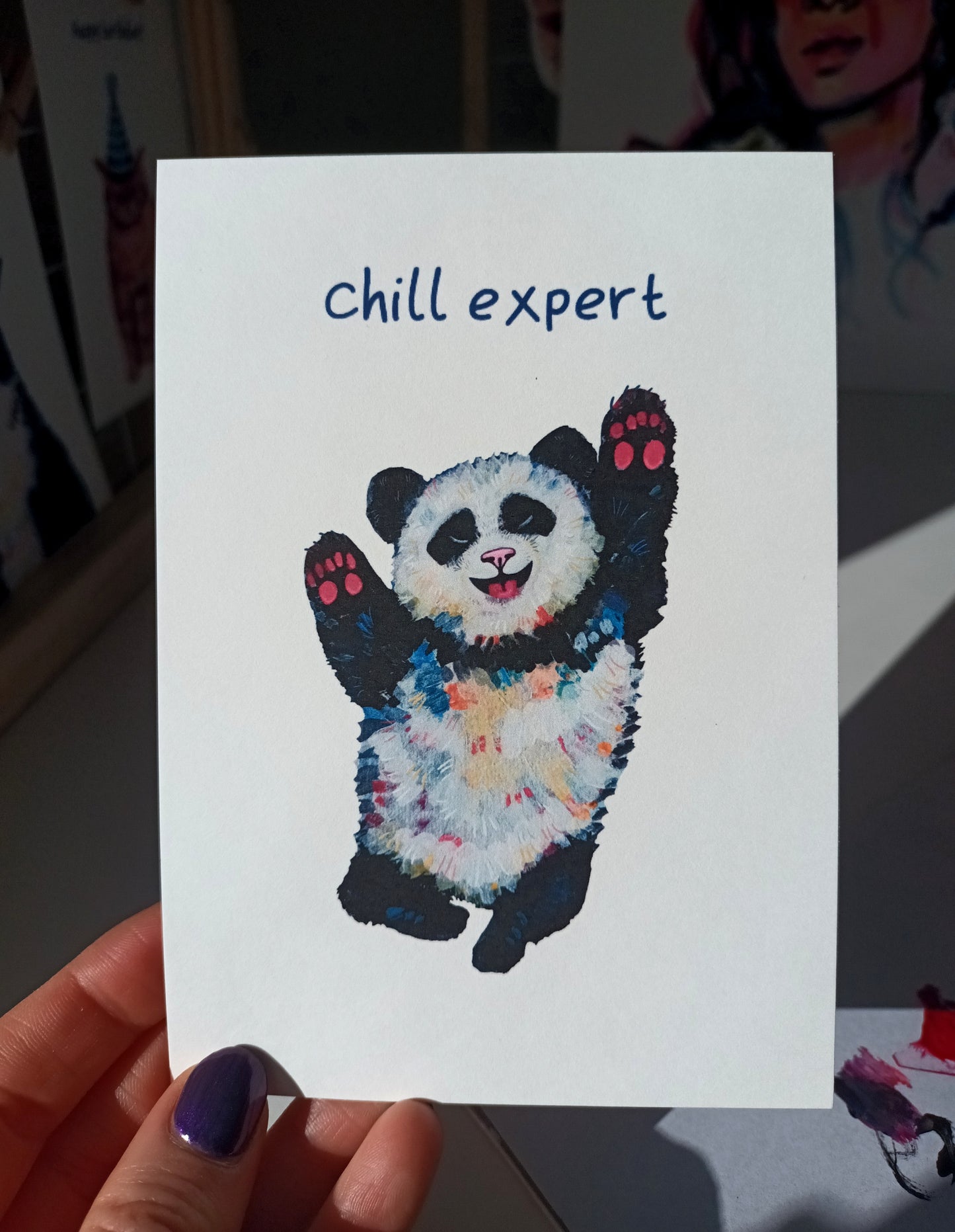 Handmade greeting card featuring a cute panda with the caption 'Chill Expert', printed on eco-friendly matte paper held by hand.