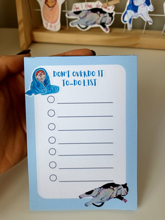 Funny cat-themed to-do list notepad with dramatic cats, light-blue background, available in 30 or 50 pages, printed on eco-friendly paper with a sturdy cardboard back