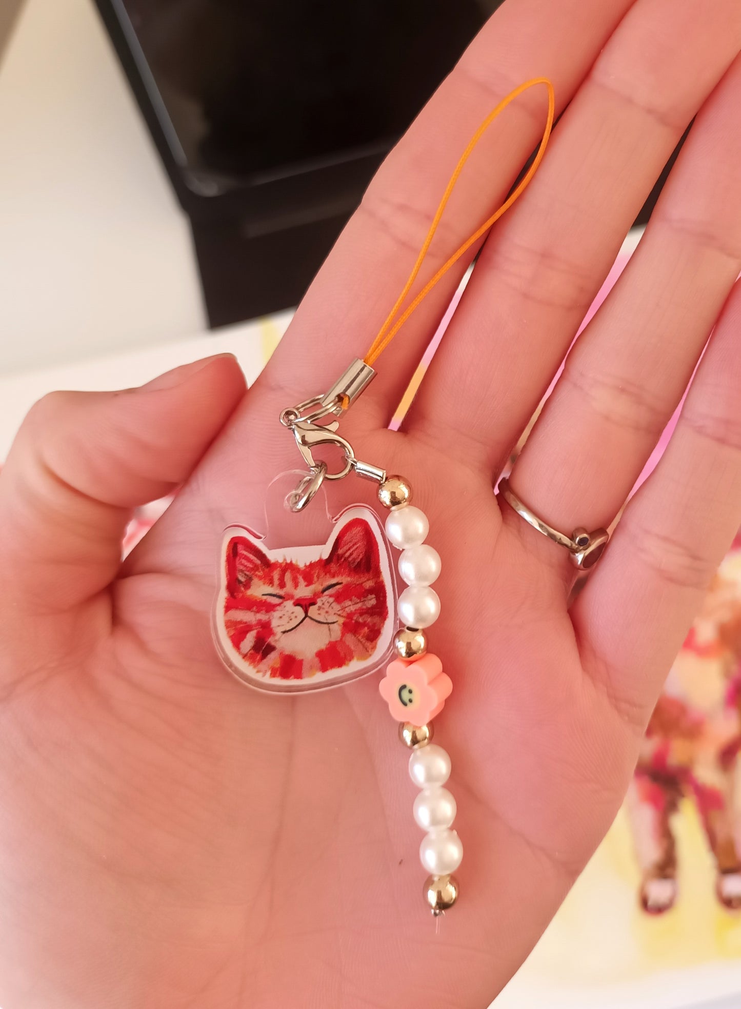 Handmade phone charm with orange cat acrylic charm, pearls, and colourful beads – a cute cat lover accessory
