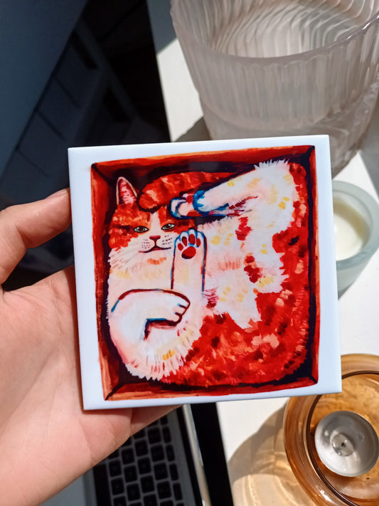 Handmade ceramic tile with cute orange cat in a box 