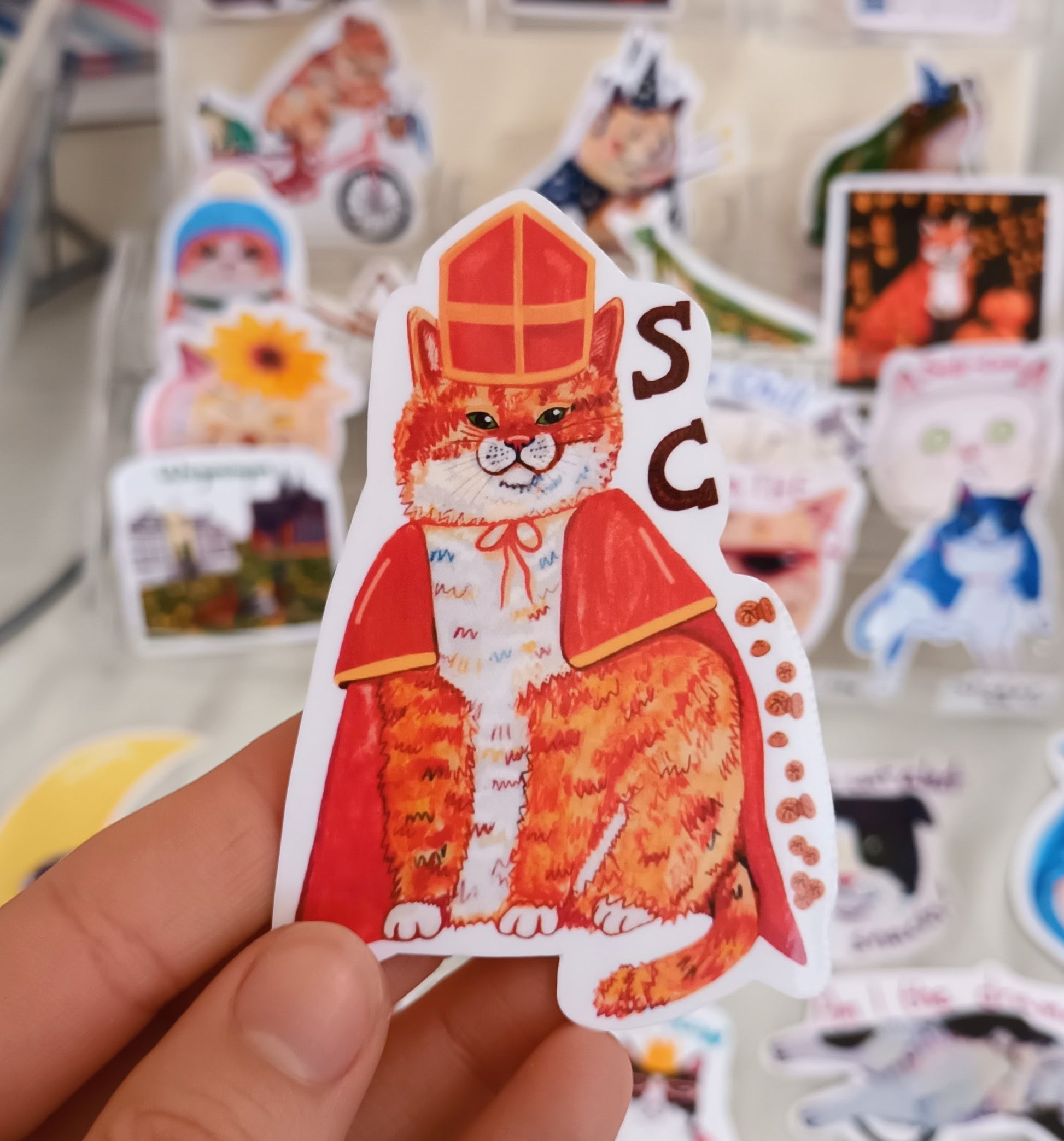 Cute Sintercat sticker inspired by Sinterklaas in the Netherlands, handmade festive cat illustration on waterproof vinyl.