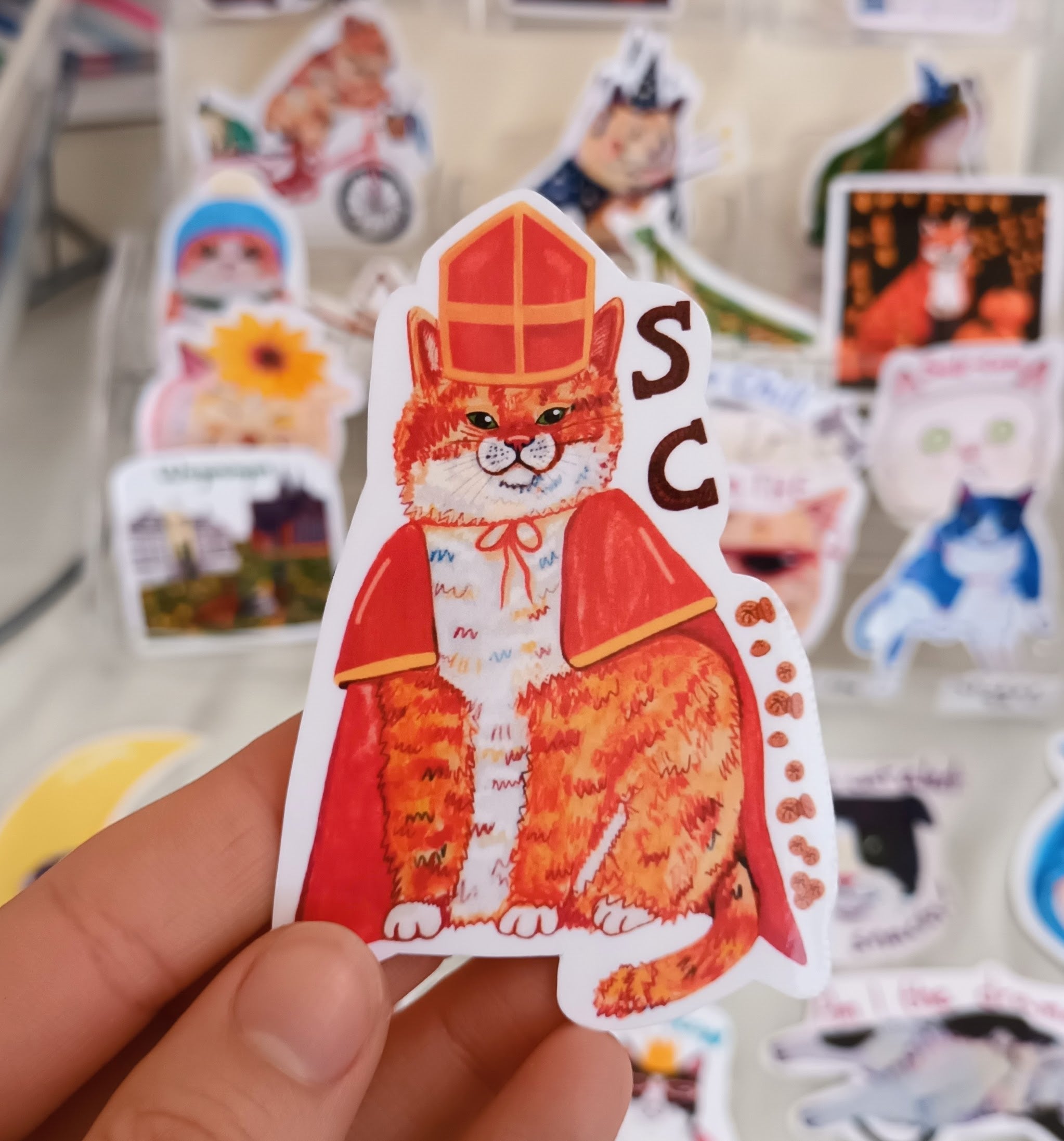 Cute Sintercat sticker inspired by Sinterklaas in the Netherlands, handmade festive cat illustration on waterproof vinyl.