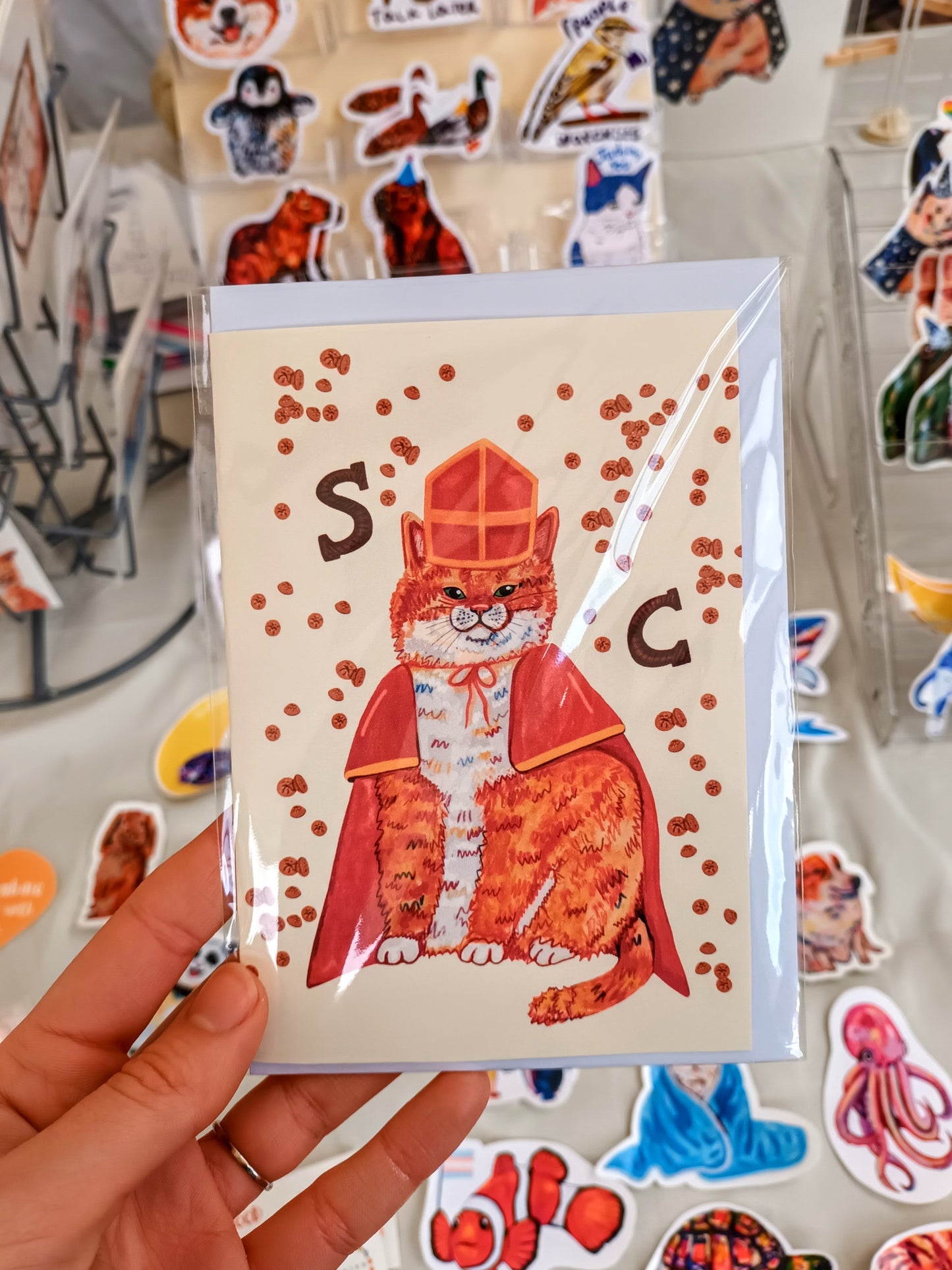 Handmade Sintercat postcard inspired by Dutch Sinterklaas, featuring a cute festive cat illustration on eco-friendly folded paper.