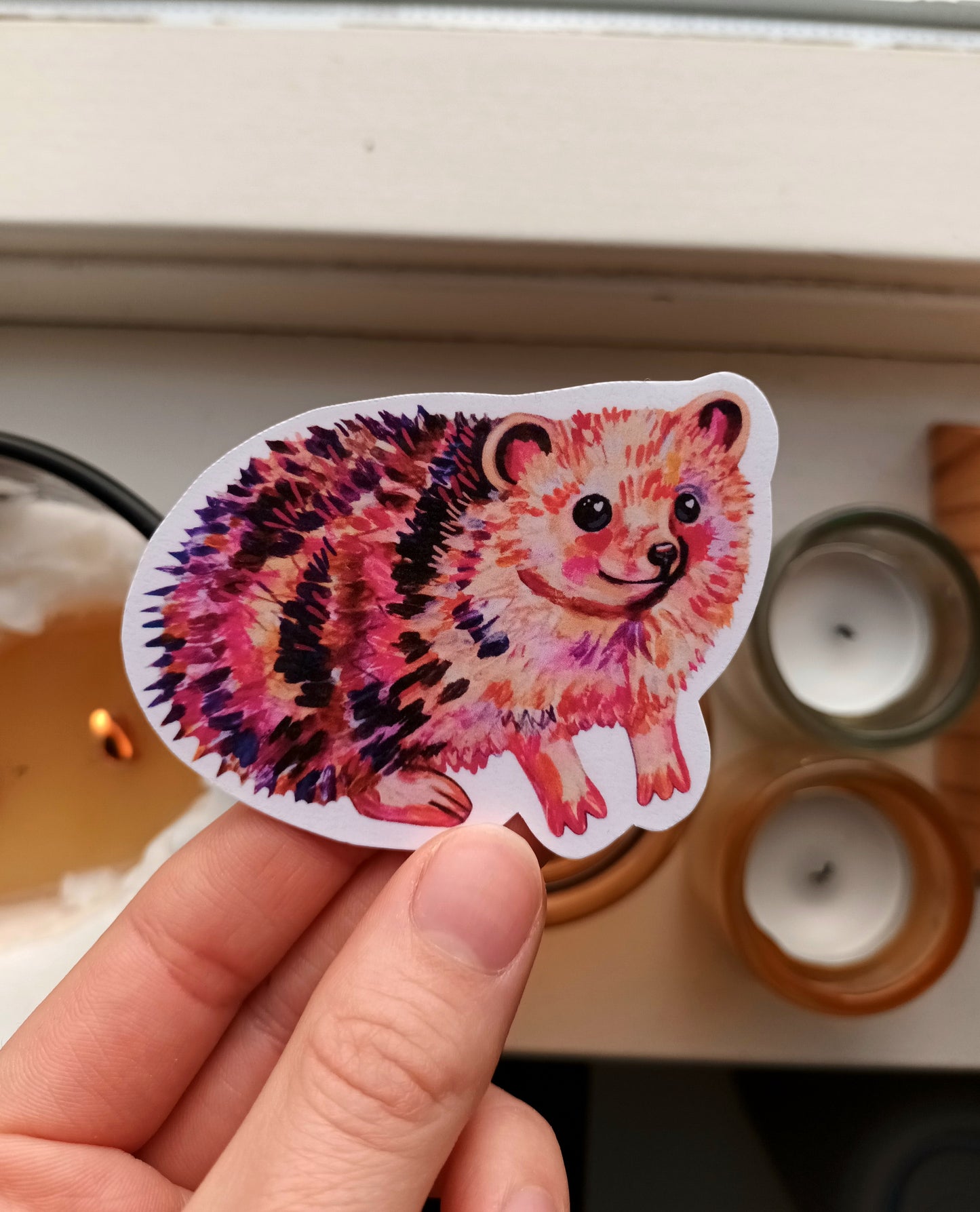 Cute handmade hedgehog sticker featuring a smiling hedgehog, printed on waterproof vinyl, nature-inspired animal art.