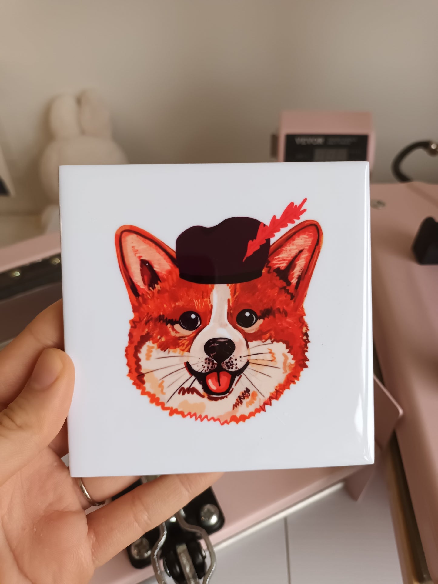 Handmade ceramic tile with festive corgi Sinterklaas helper illustration, printed by the artist, 11 x 11 cm