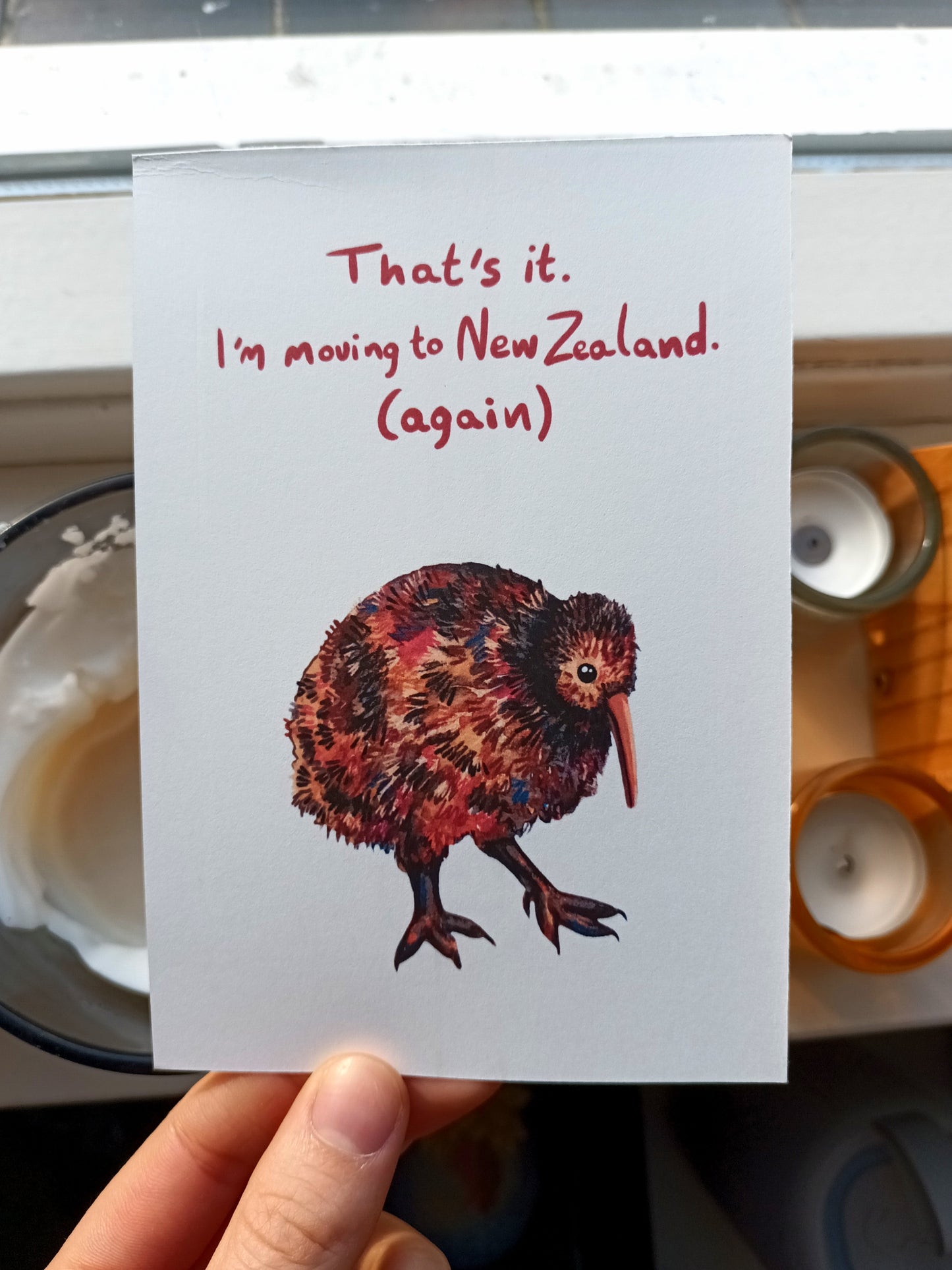 Moving Kiwi postcard with “I’m moving to New Zealand (again)” text, original illustration by the artist