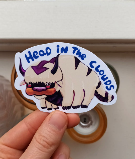 Cute Appa fanart sticker with “head in the clouds” text, original illustration by the artist, 9.11 x 6 cm