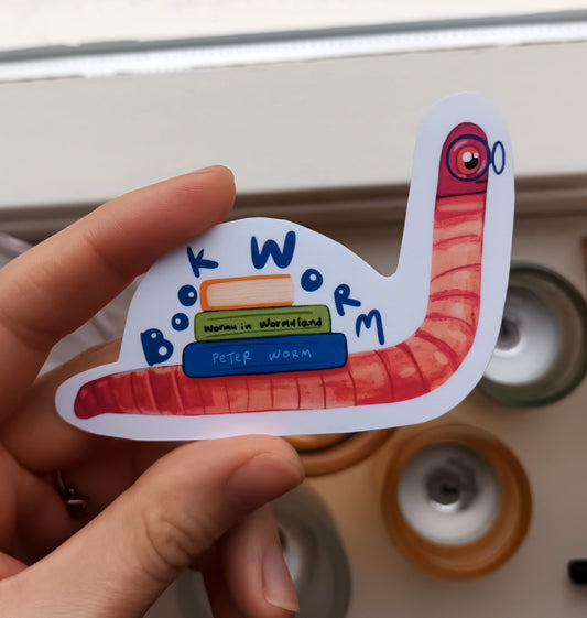 Cute book worm sticker with glasses and books on its back, original illustration