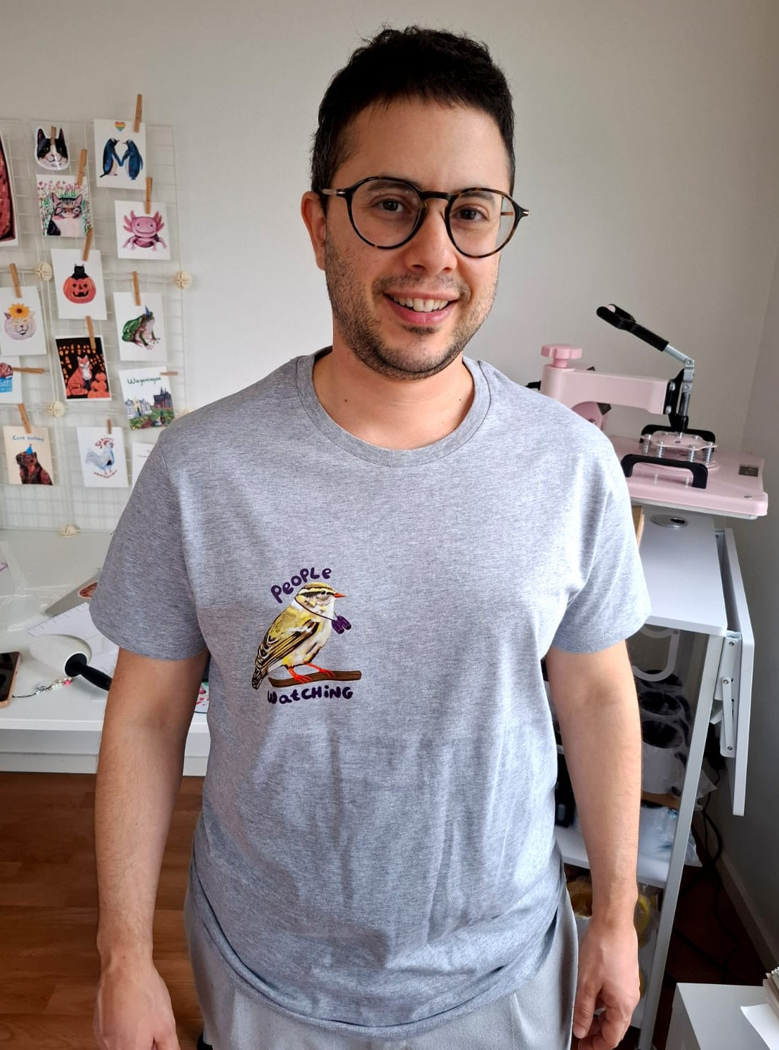 Grey organic cotton T-shirt with People Watching Bird illustration printed by the artist