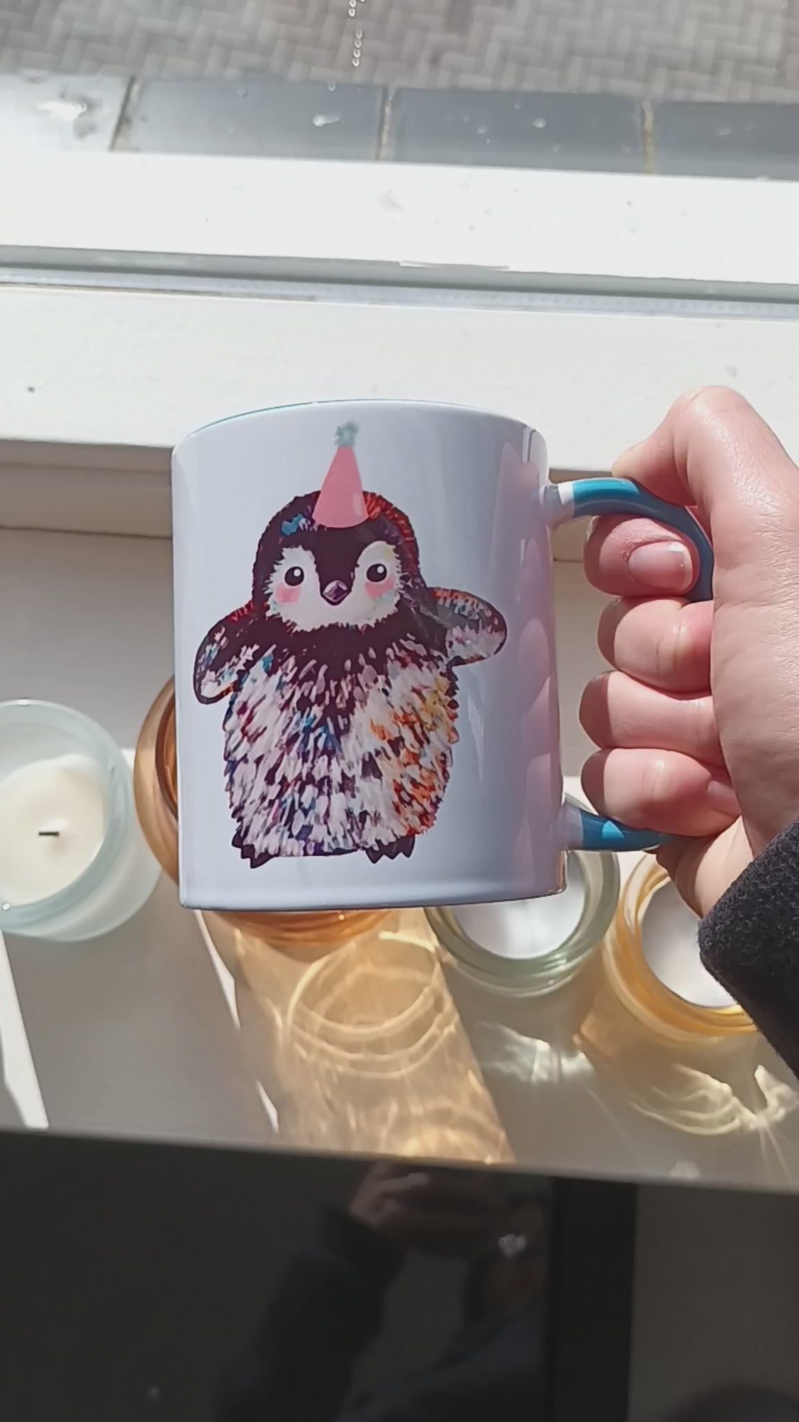 Cute penguin mug with pink party hat and blue handle